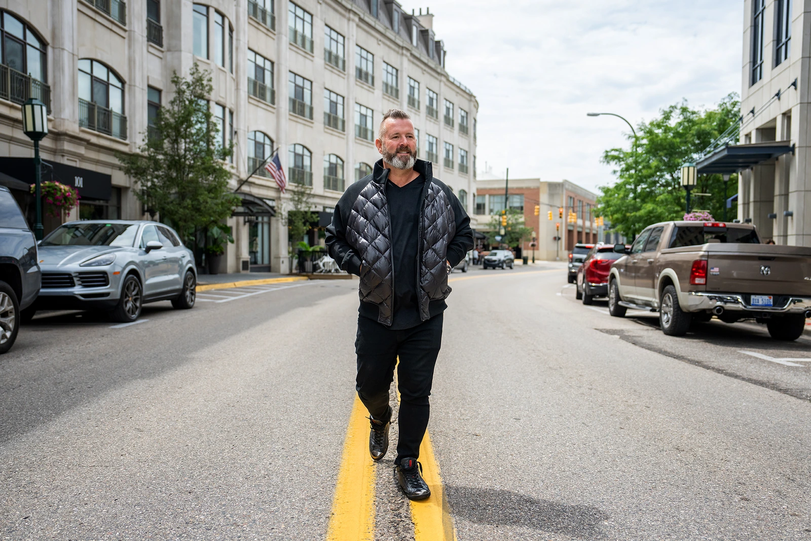 Rick Van House walking along a downtown street